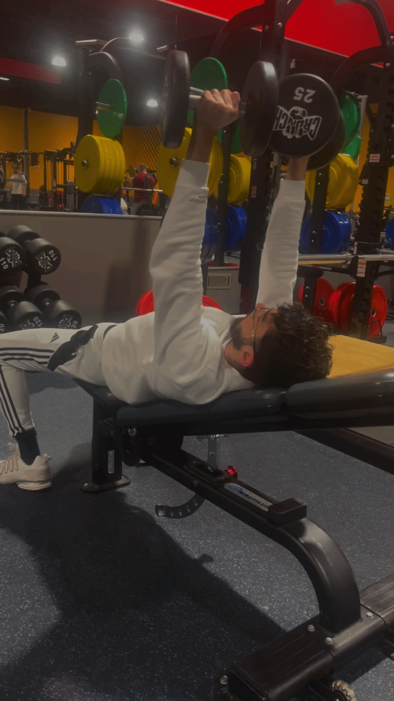 Client bench press under coaching